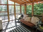 The screen porch is a great spot to sit and relax